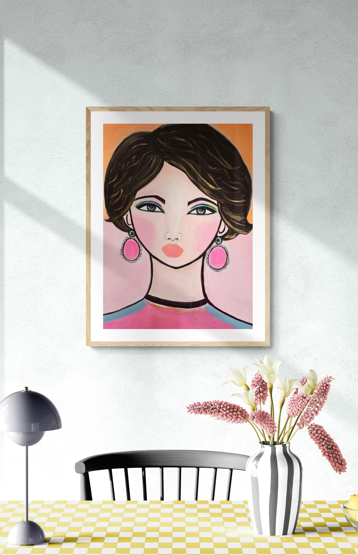 Girl in Pink original portrait painting displayed in a colorful room